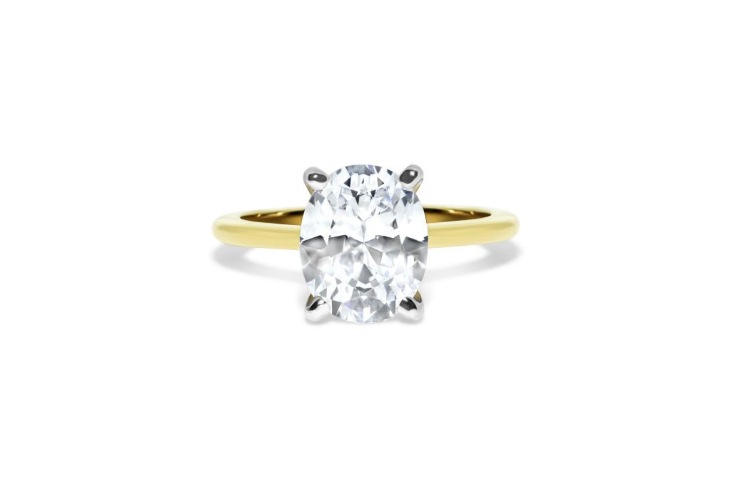 Two tone oval solitaire engagement ring