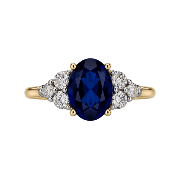 Oval blue sapphire and diamond ring in 10K yellow gold, with diamond accent clusters — Rodan Jewellers Vancouver